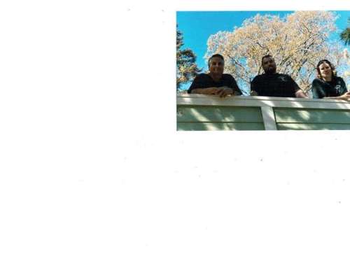 Shab, Ryan, Isaiah on driveway fence. Look how beautiful the sky is. You would never know the forest is destroyed.JPG