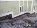 Side of house, ashes, melted waterproofing.JPG