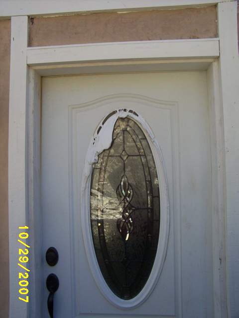 Melted door, completely detatched inside, note fire damage on handle.JPG