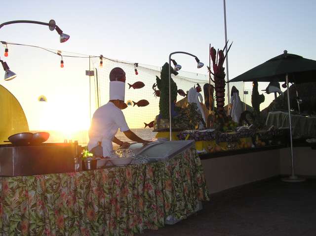 Lobster served on the beach at sunset
