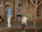 Lanell, Maddie, Tristan by the backyard shotgun house_game room