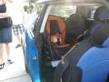 the car seat fits in the Mini; see Amy barely looking pregnant in the background