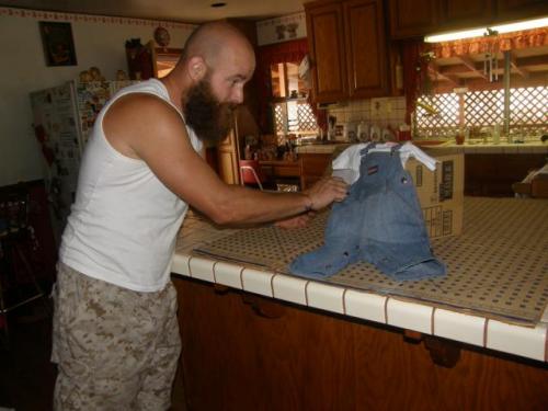 Uncle Shane fixing overalls with t-shirt