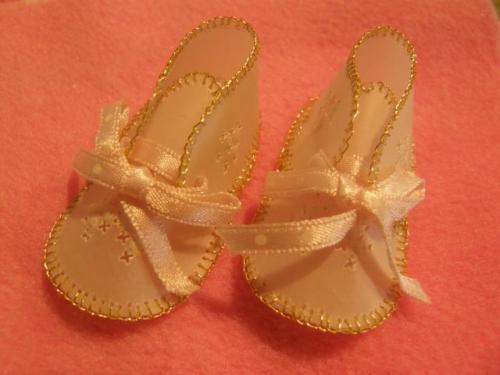 Masaco's mother, Junko, made the vellum baby shoes