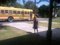 Maddie getting off the bus at Nonnie's