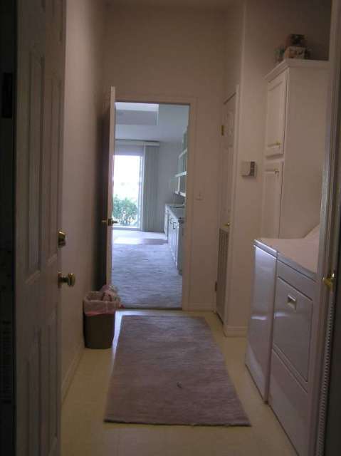 view from garage into laundry room into family room